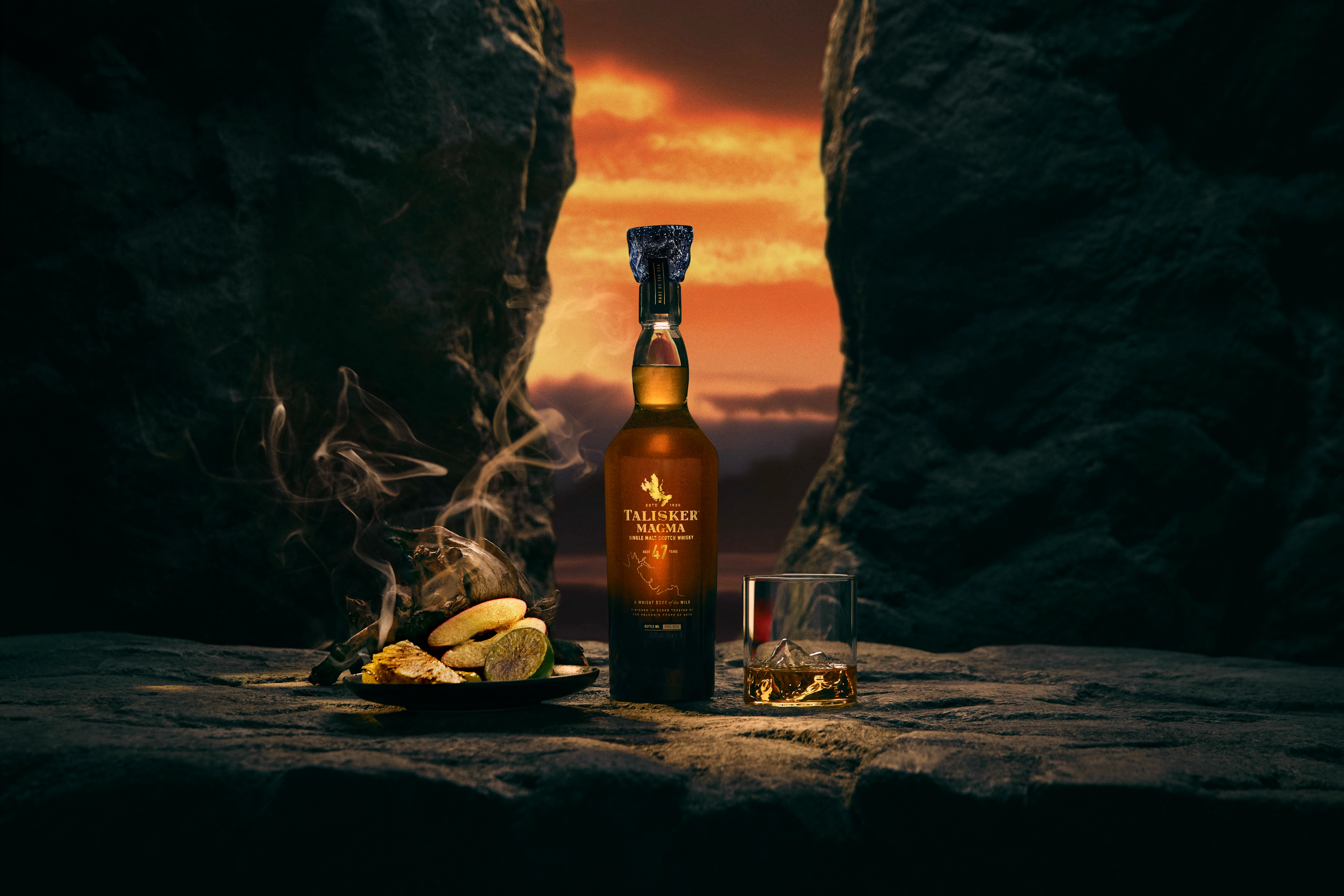 Talisker 47 Year Old Magma Single Malt Whisky beside smokey spices and single serve on volcanic rock