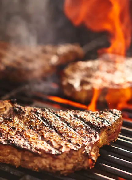 Two steaks on a barbecue