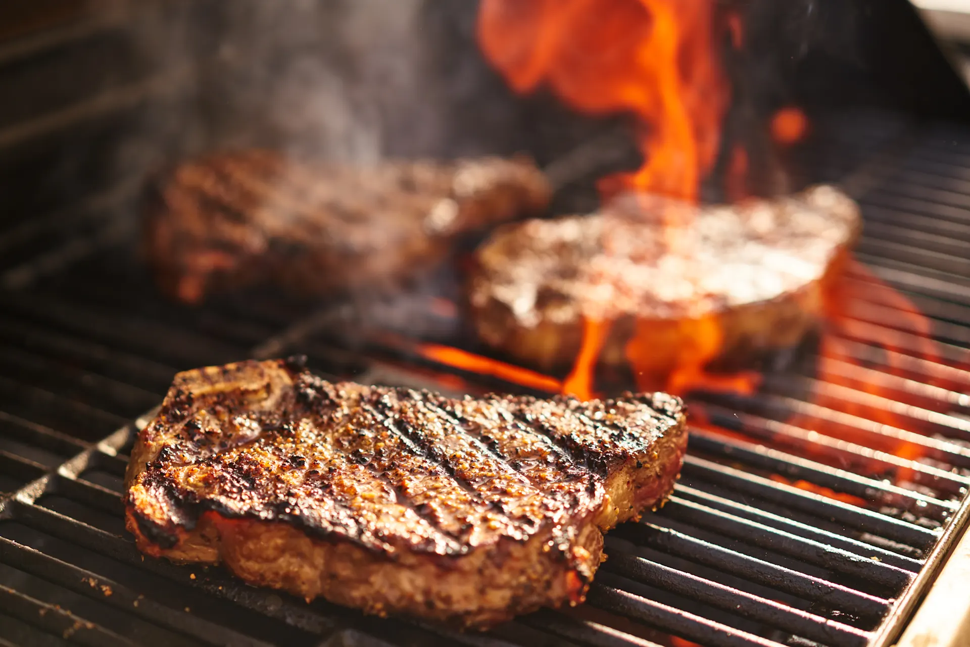 Two steaks on a barbecue