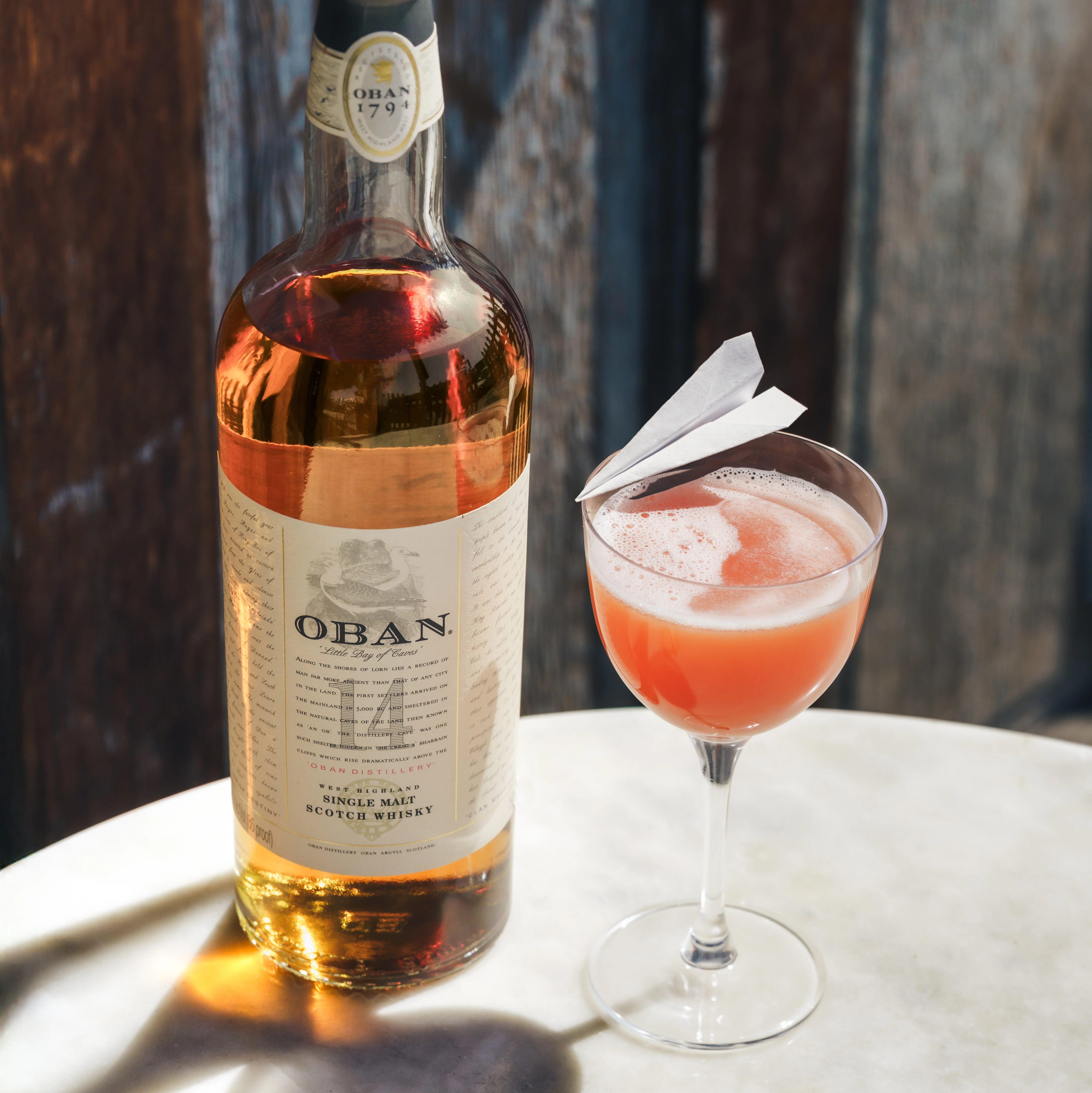 Image of Oban Paper Plane cocktail with Oban 14 bottle