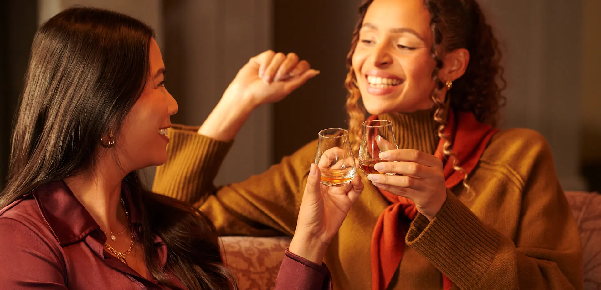 Two women drinking whisky 