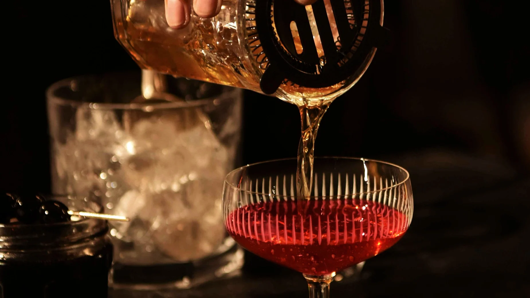 Rob Roy Cocktail being poured into a glass