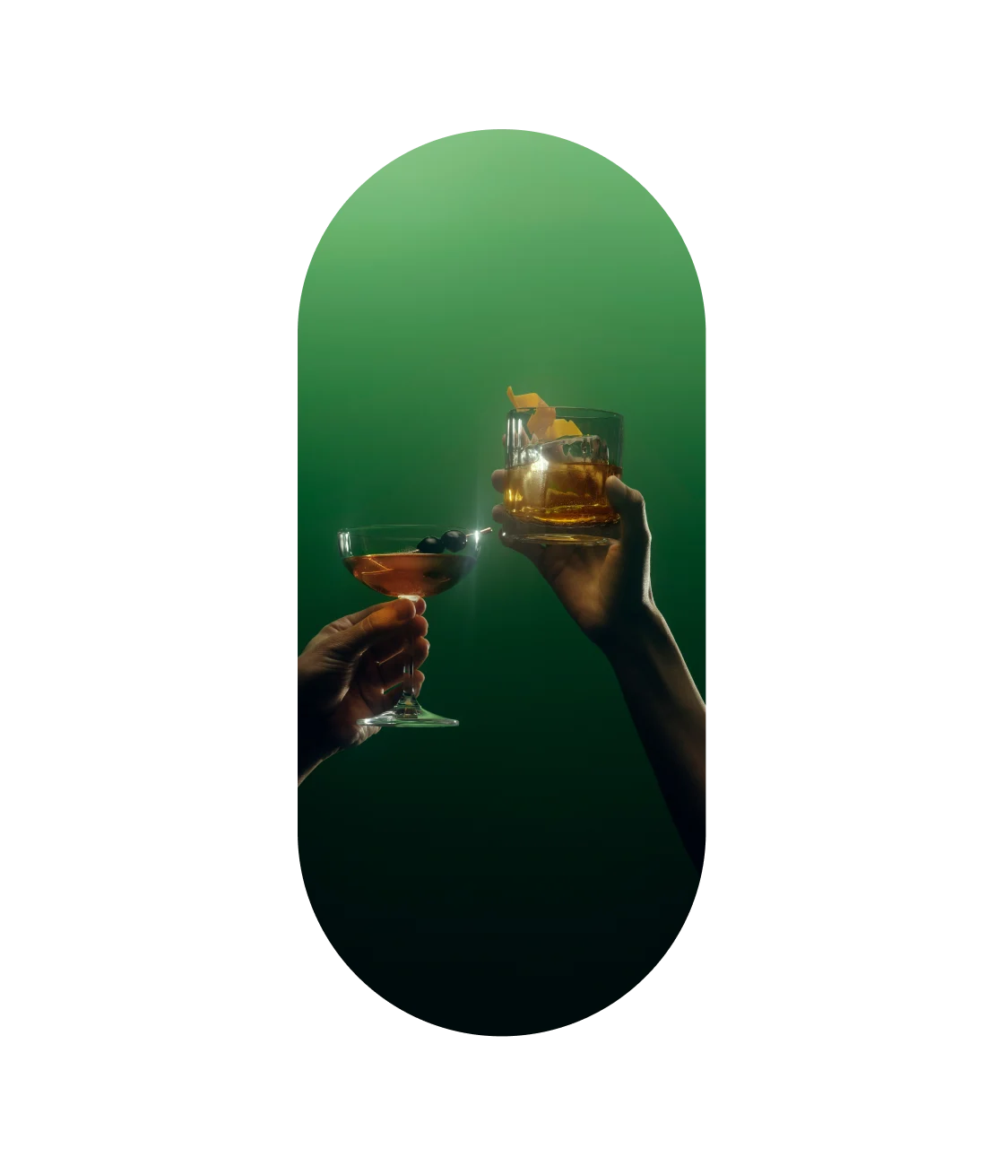 Two hands holding Lagavulin cocktails toasting each other in green-tinted lighting