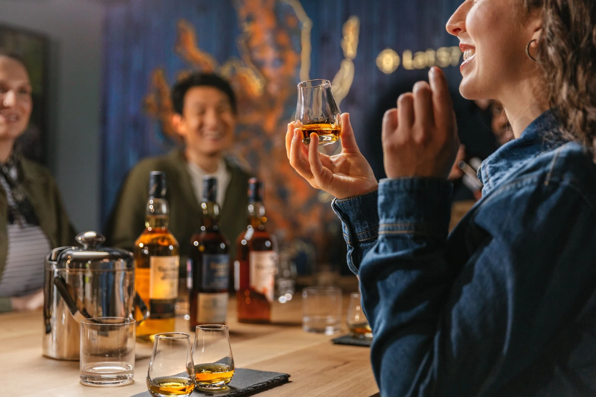 A group of people take part in a whisky tasting experience