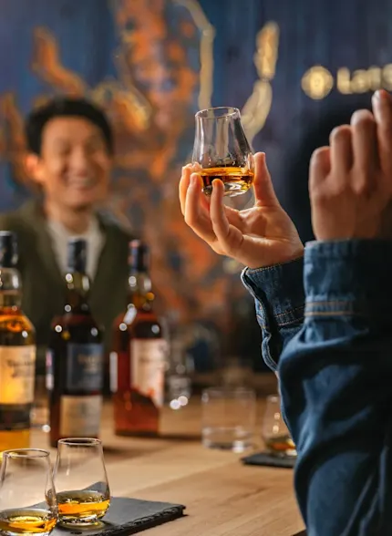 A group of people take part in a whisky tasting experience