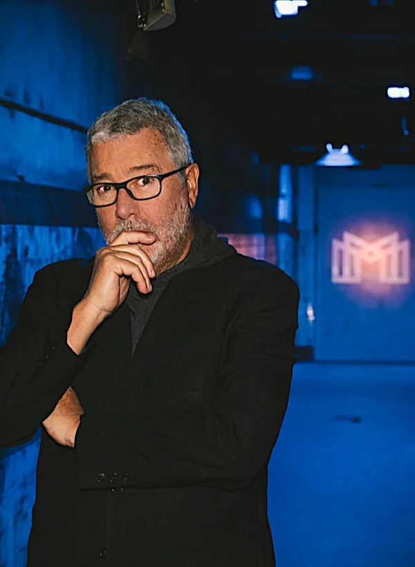 Learn more Starck  L’Evolution full body pose infornt of the Mortlach logo