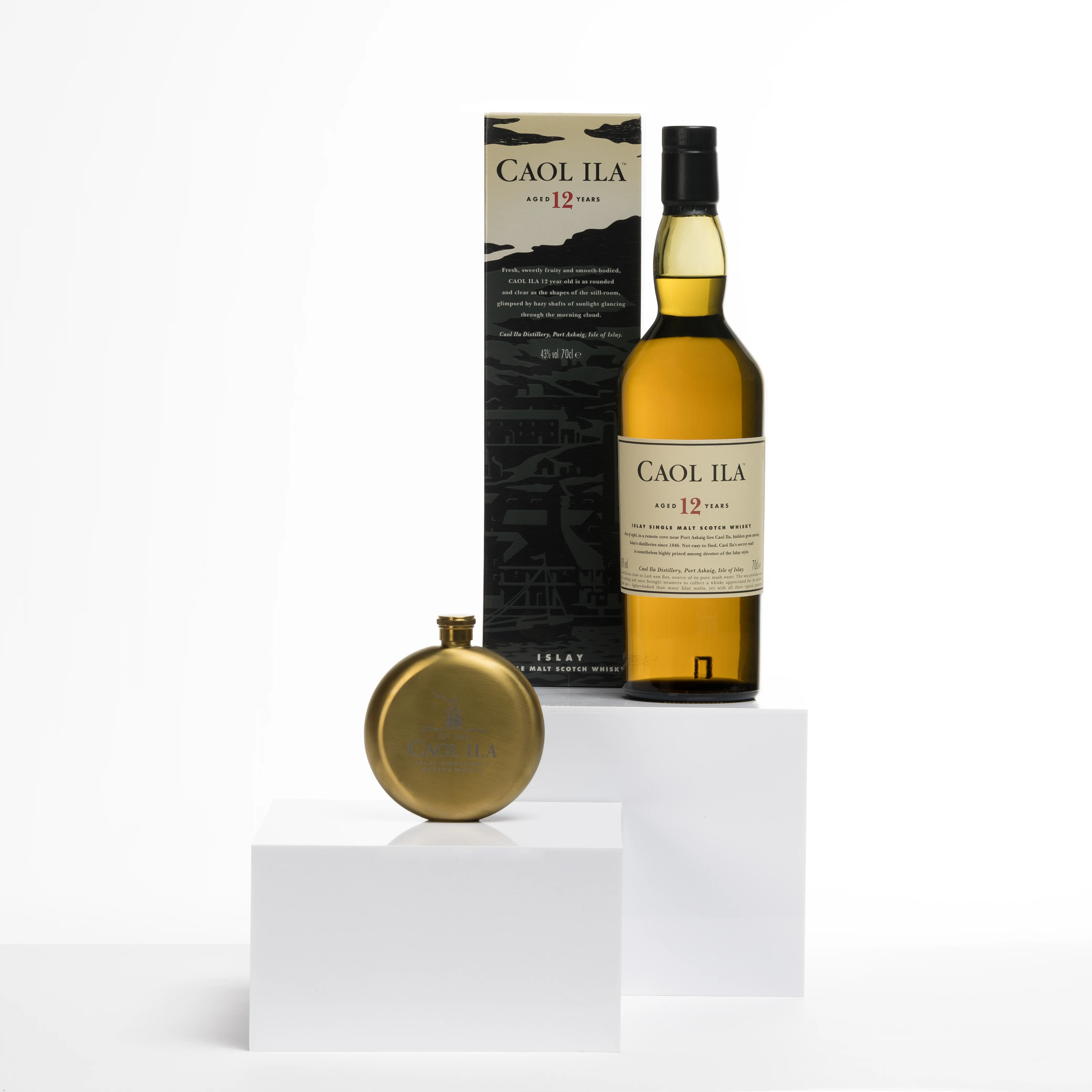 A Caol Ila 12 bottle and a golden flask with Caol Ila branding arranged on white pedestals.