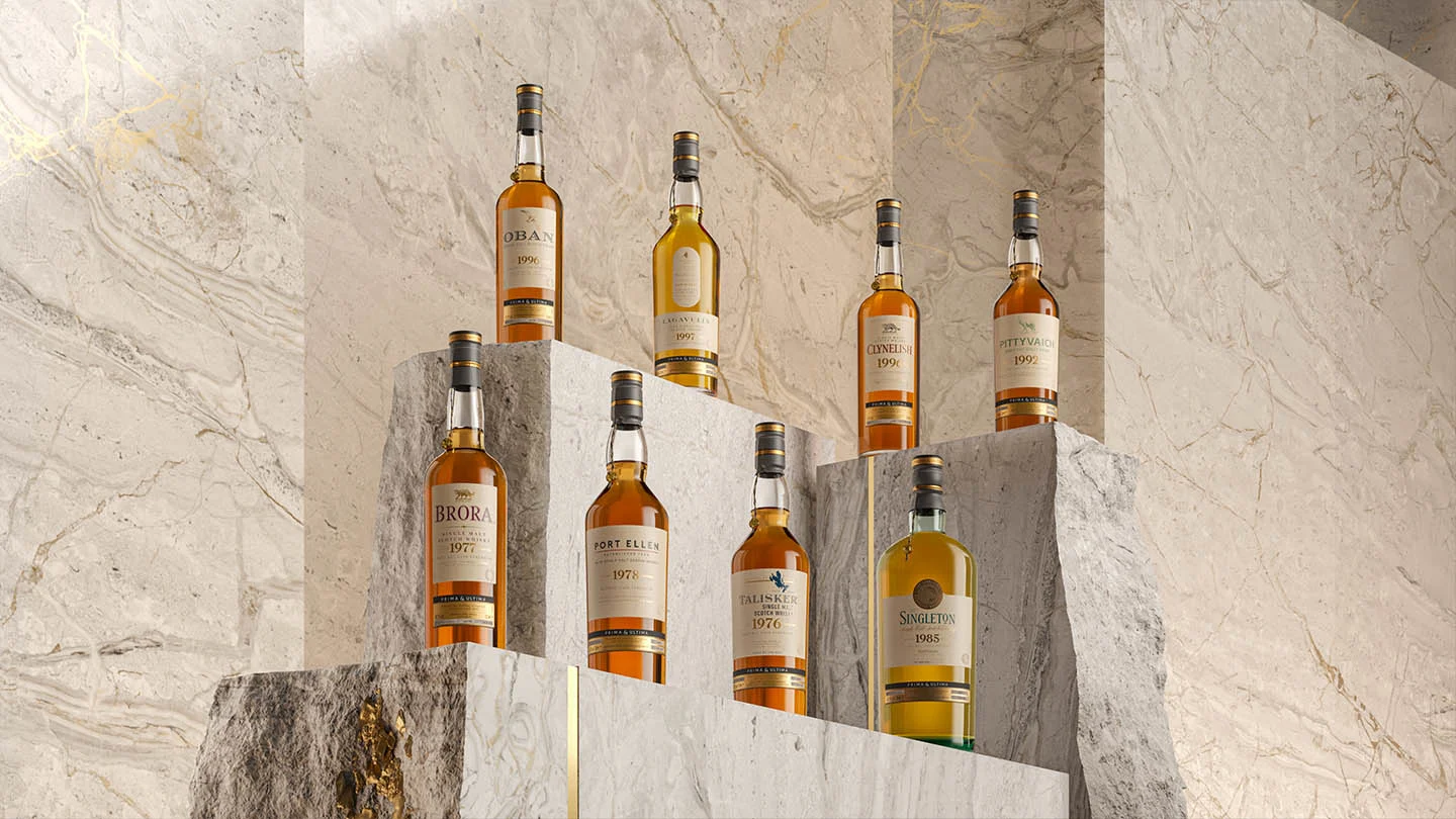 A collection of whiskey bottles elegantly displayed on a polished marble pedestal, showcasing their rich colors and labels.