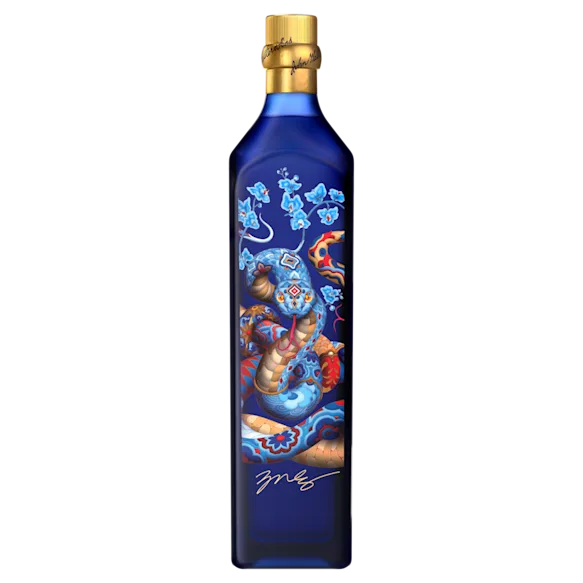 A close-up of the Johnnie Walker Blue Label bottle featuring James Jean's intricate artwork with floral and snake motifs.