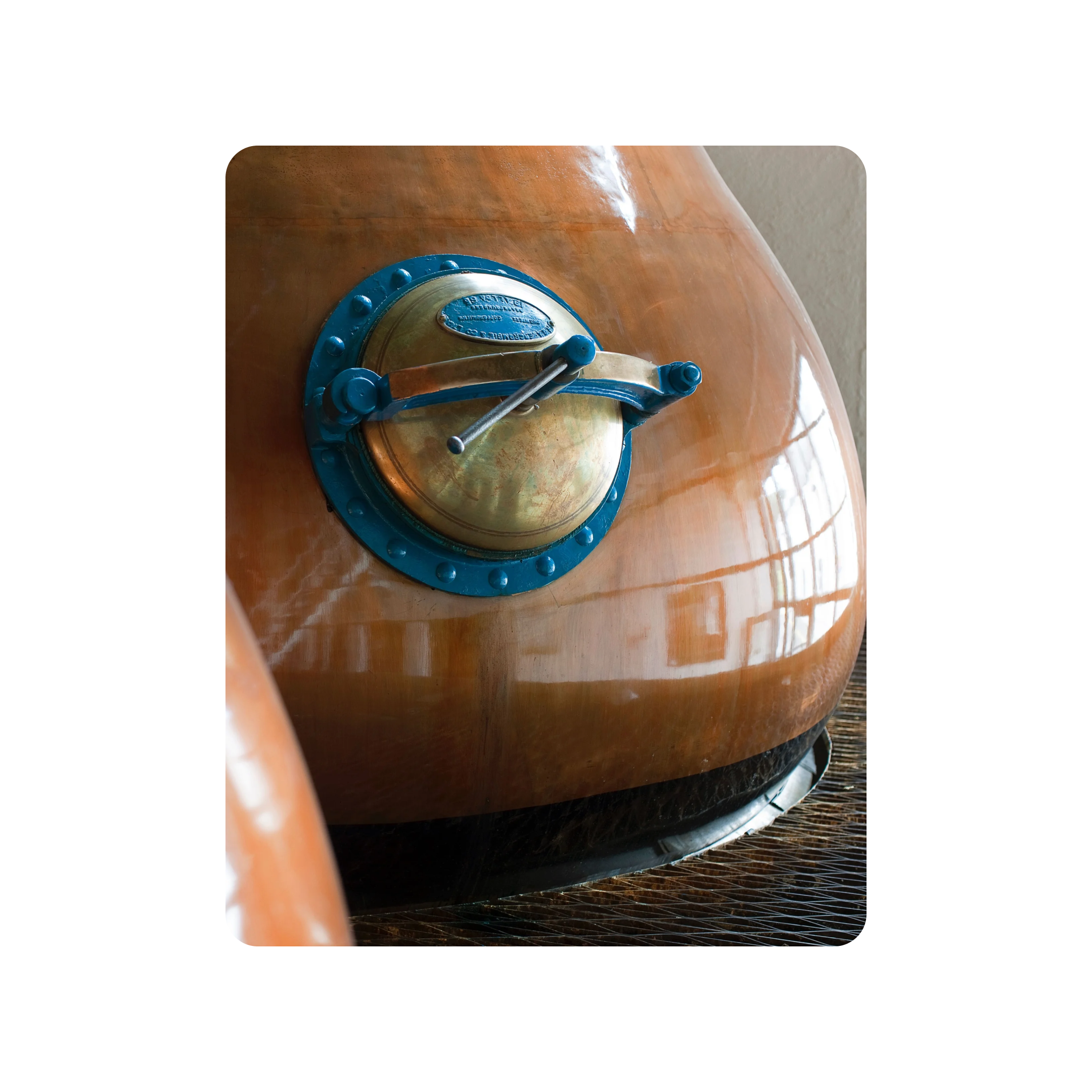 A shining copper pot still used during the distillation process of Lagavulin's finest whisky. 