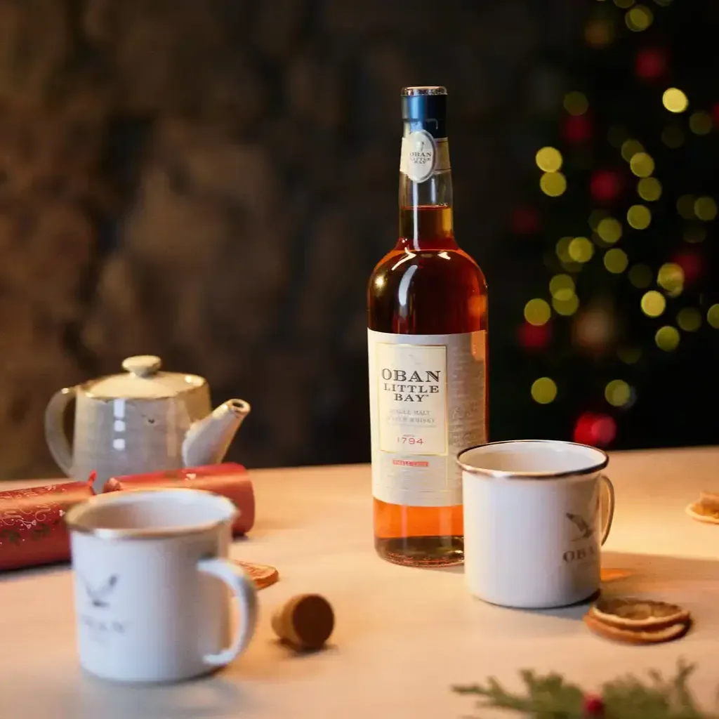 A couple visiting Oban retail shop and checking in one of the Oban special edition bottles