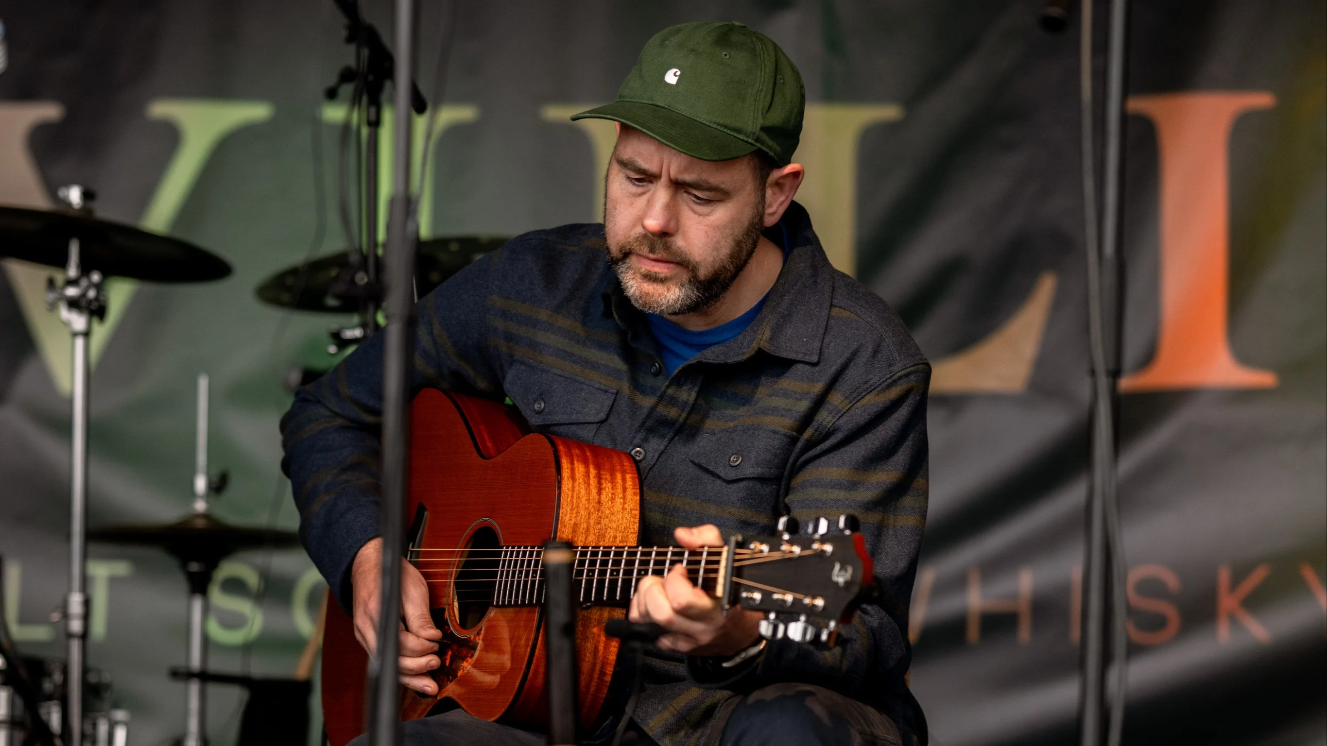 Musician performing at the Islay Festival with his guitar