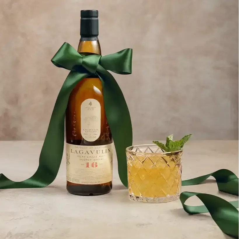Bottle of Lagavulin placed in one of the branches of a Christmas tree