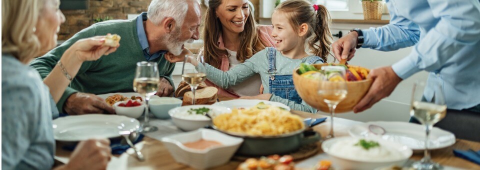 happy-extended-family-having-fun-during-family-lunch-in-dining-room-picture-id1215369487 (1)