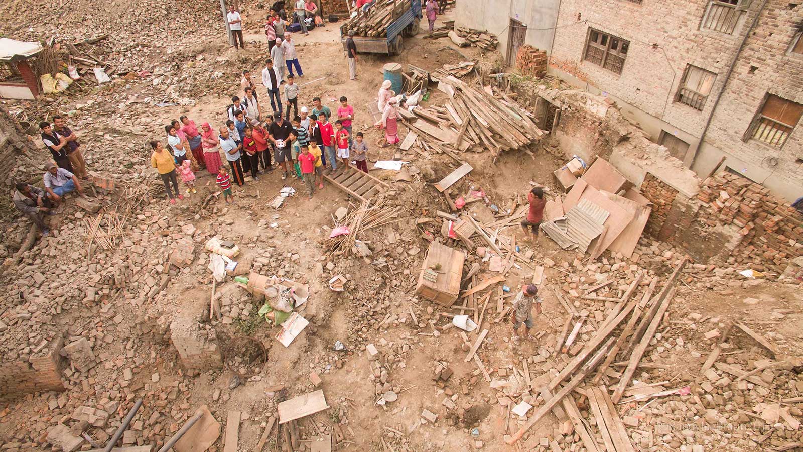 A group of people standing in the street in Nepal