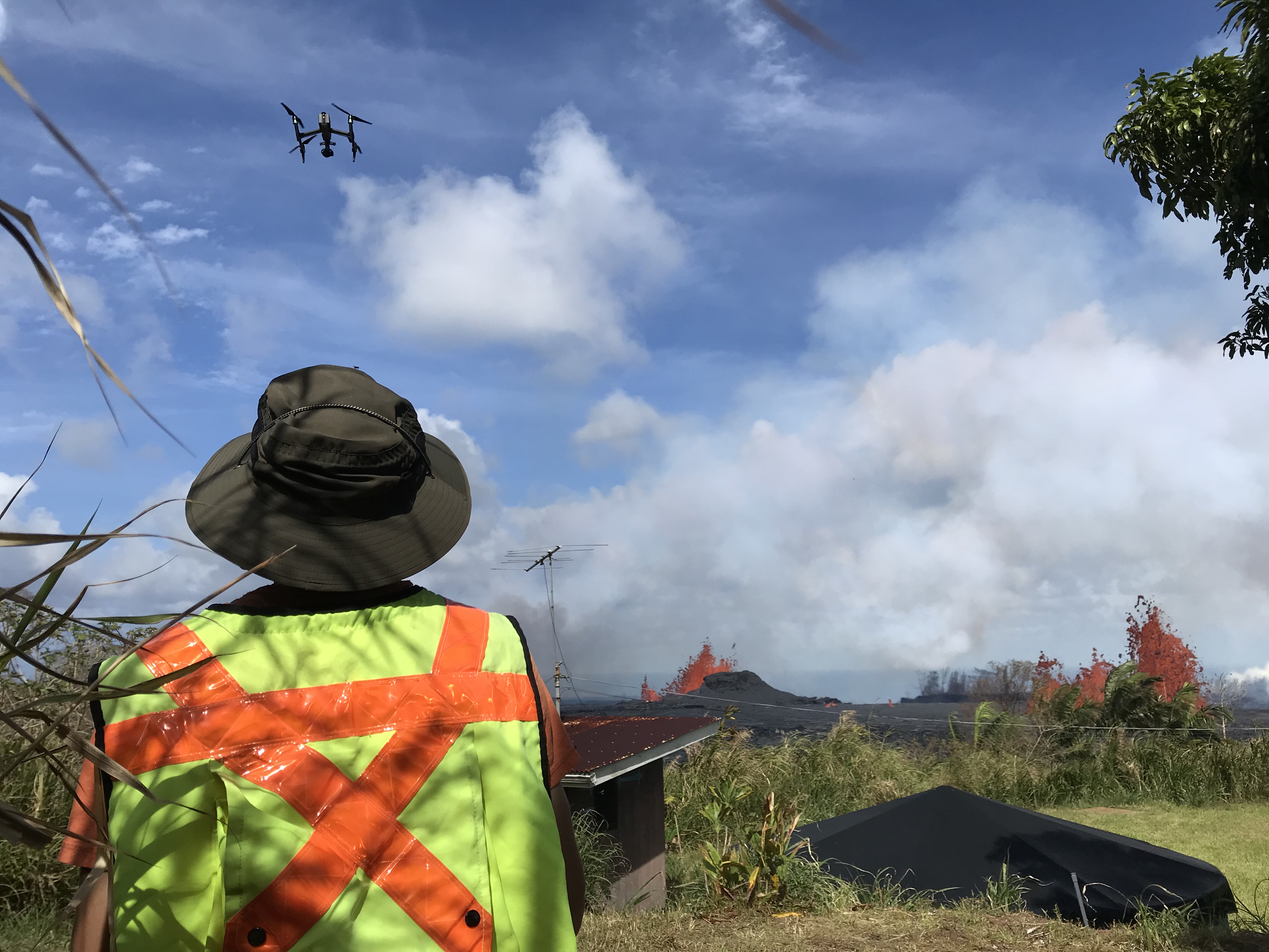 Flying a drone in front of a volcanic eruption