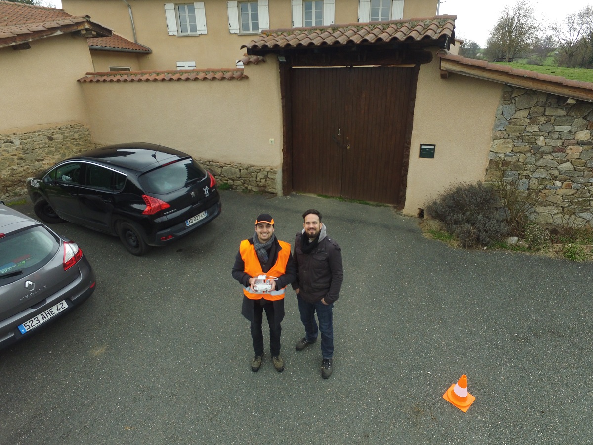The Prodigo team flying a drone outside a client's property.