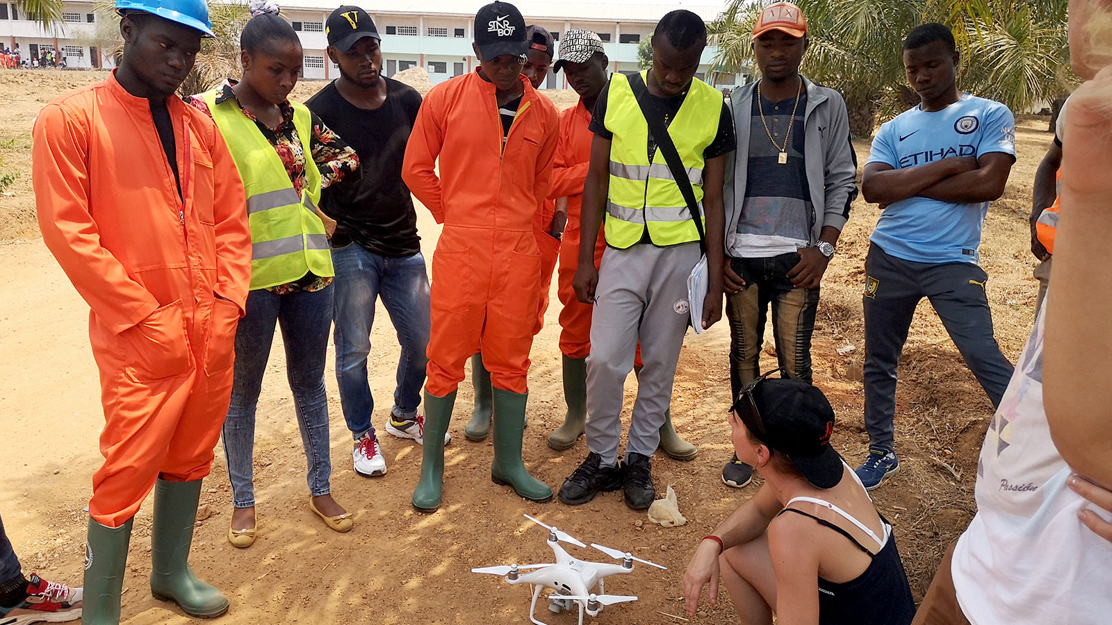 Team circled around a DJI Phantom 4