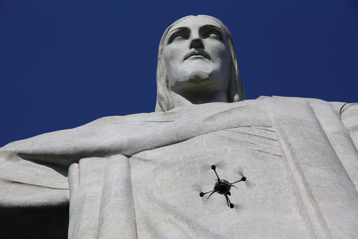 drone flying in-front of the statue of Christ the Redeemer in Rio