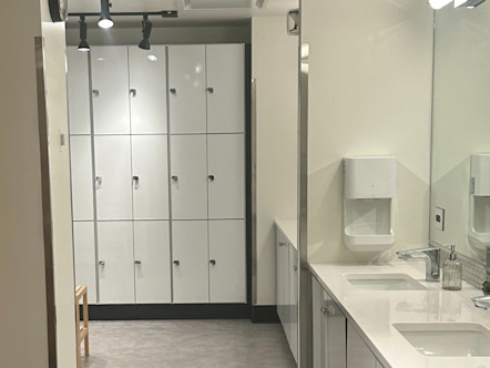 Pristine white lockers and vanities in a yoga studio