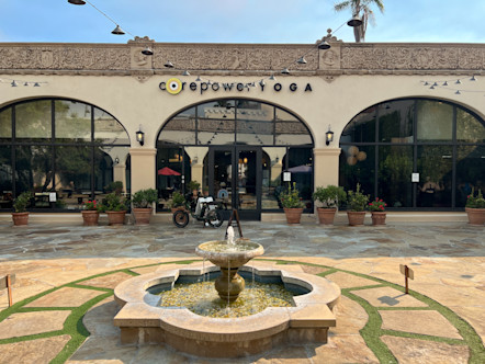 CorePower sign displayed on the State Street studio's tan stucco building and arched, window doorways