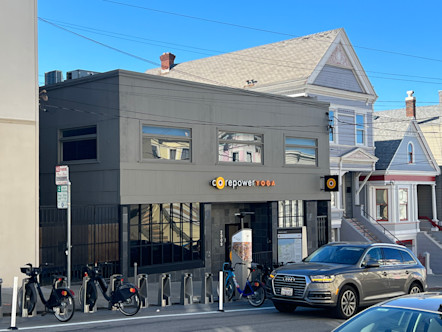 CorePower Yoga Cow Hollow studio logo displayed on gray paneled and stone building