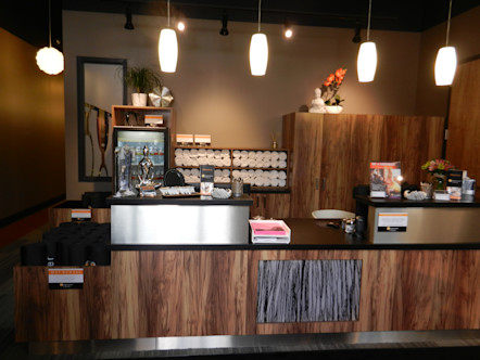 Wooden cabinetry displaying fresh yoga towels