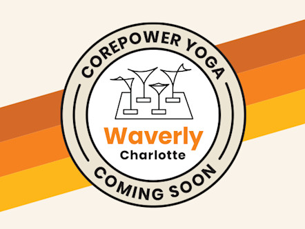 Circular logo for CorePower Yoga coming soon to Charlotte, North Carolina with clock tower icon on orange and yellow stripes