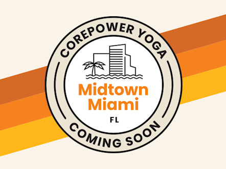 Tan and white CorePower Yoga coming soon target logo with orange Midtown Miami lettering in the center and a Miami skyline icon to indicate the area