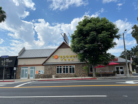 Sherman Oaks CPY studio with a partial A-frame roof and a black CPY billboard sign directly above