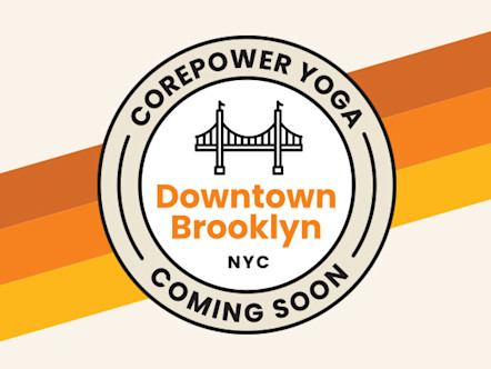 Tan and white CorePower Yoga coming soon target logo with orange Downtown Brooklyn lettering in the center and a Brooklyn Bridge icon to signify the neighborhood