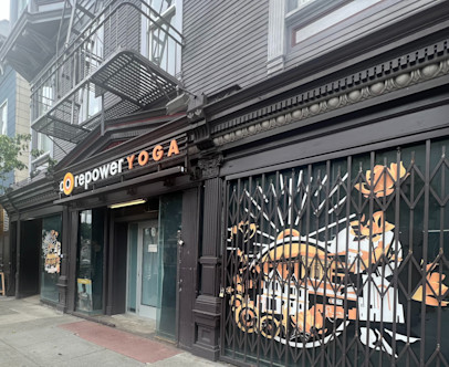 CorePower Yoga NoPa studio's CorePower Yoga exterior sign displayed on dark brown molding