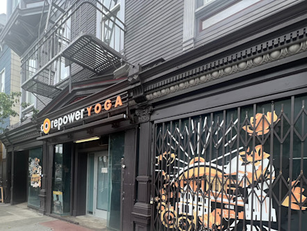 CorePower Yoga NoPa studio's CorePower Yoga exterior sign displayed on dark brown molding