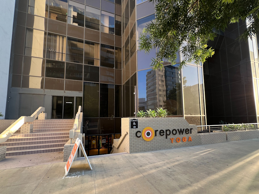 The CorePower Yoga sign on the plaza outside the Wilshire Boulevard tower that houses the studio