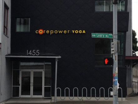 Ballard studio exterior with CPY sign above entrance on a dark grey building 