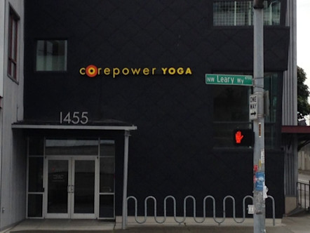 Ballard studio exterior with CPY sign above entrance on a dark grey building