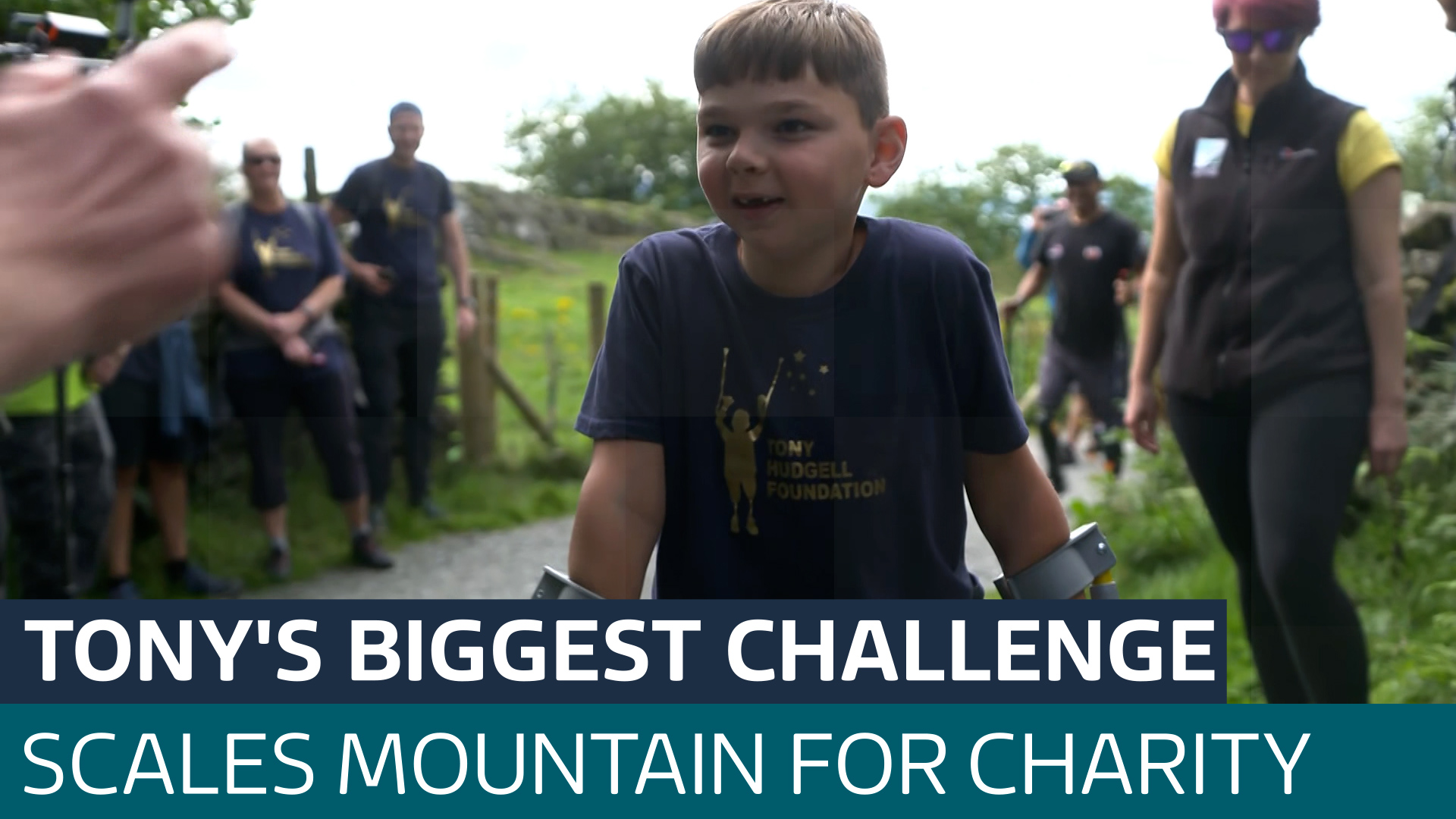Boy who lost his legs after abuse climbs Lake District mountain for