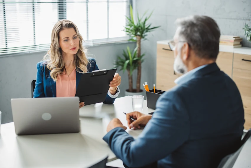 man and woman in a meeting