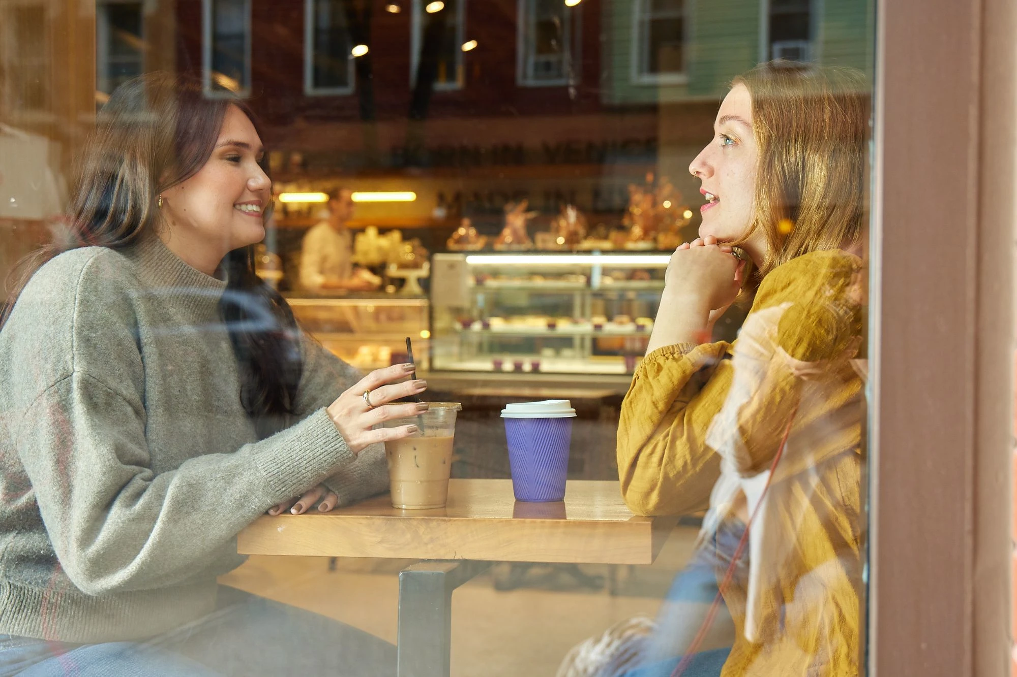 Work With Us - Benefits and Perks - 2 women in a cafe chatting