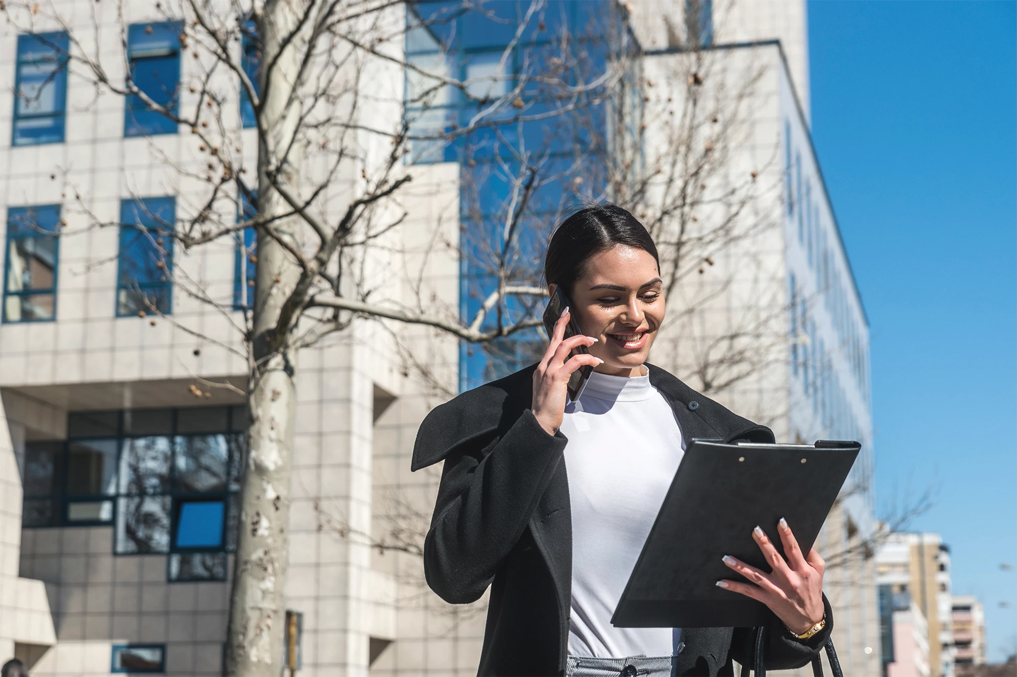 dearborn - woman outdoors with cellphone