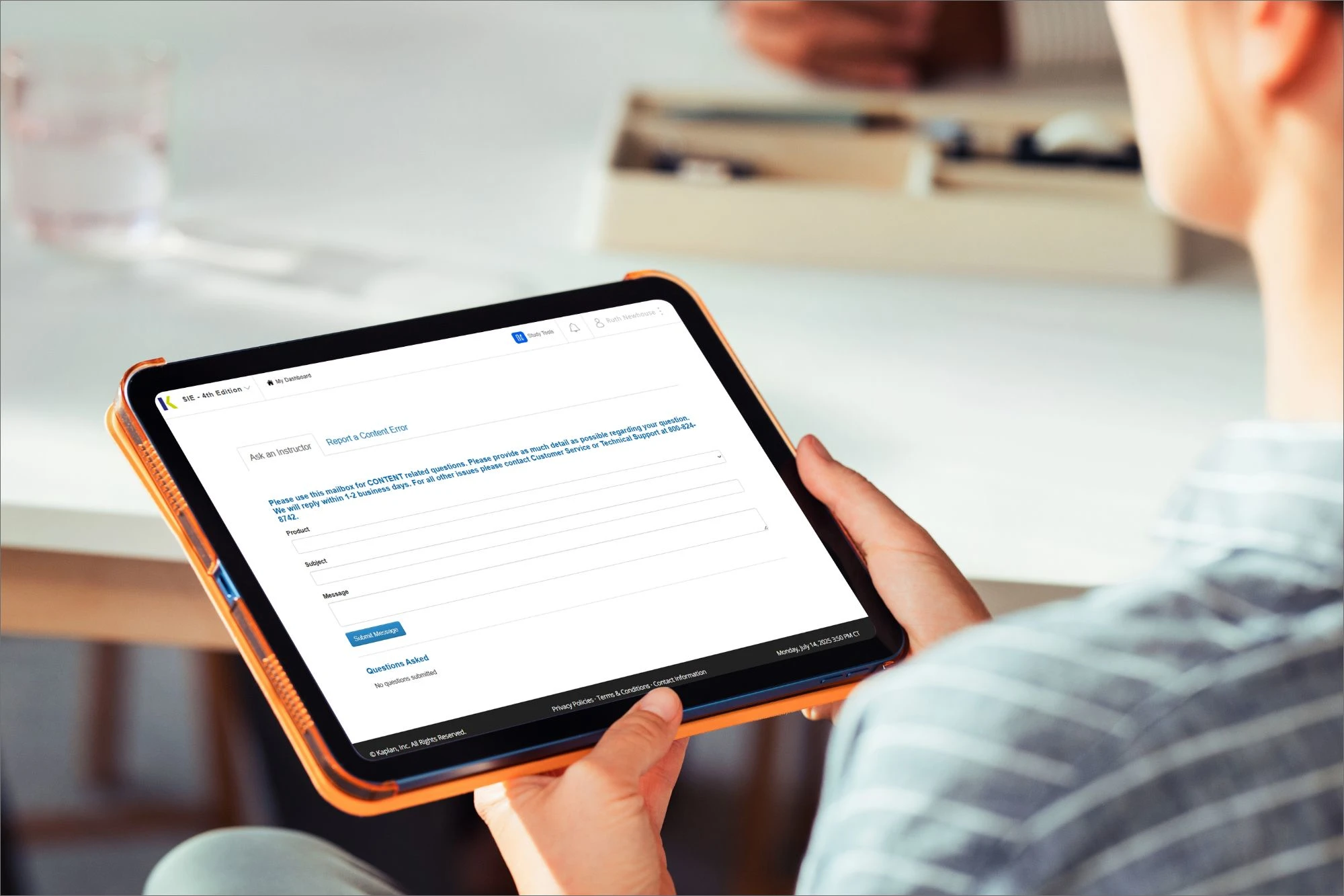 woman looking at tablet studying for securities exam