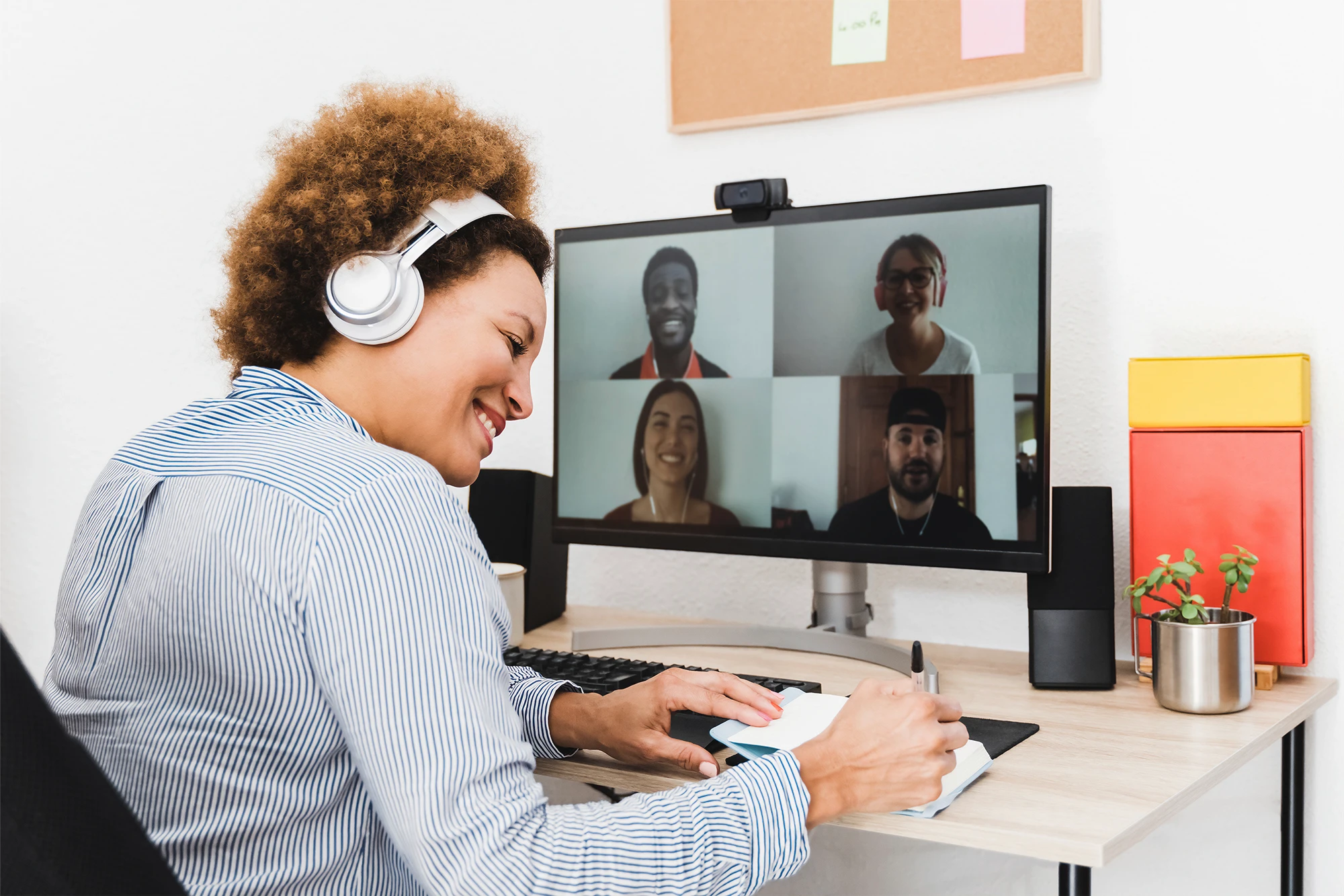 dearborn - woman having virtual meeting wearing headphones