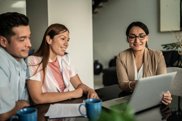 man and woman meeting with advisor 