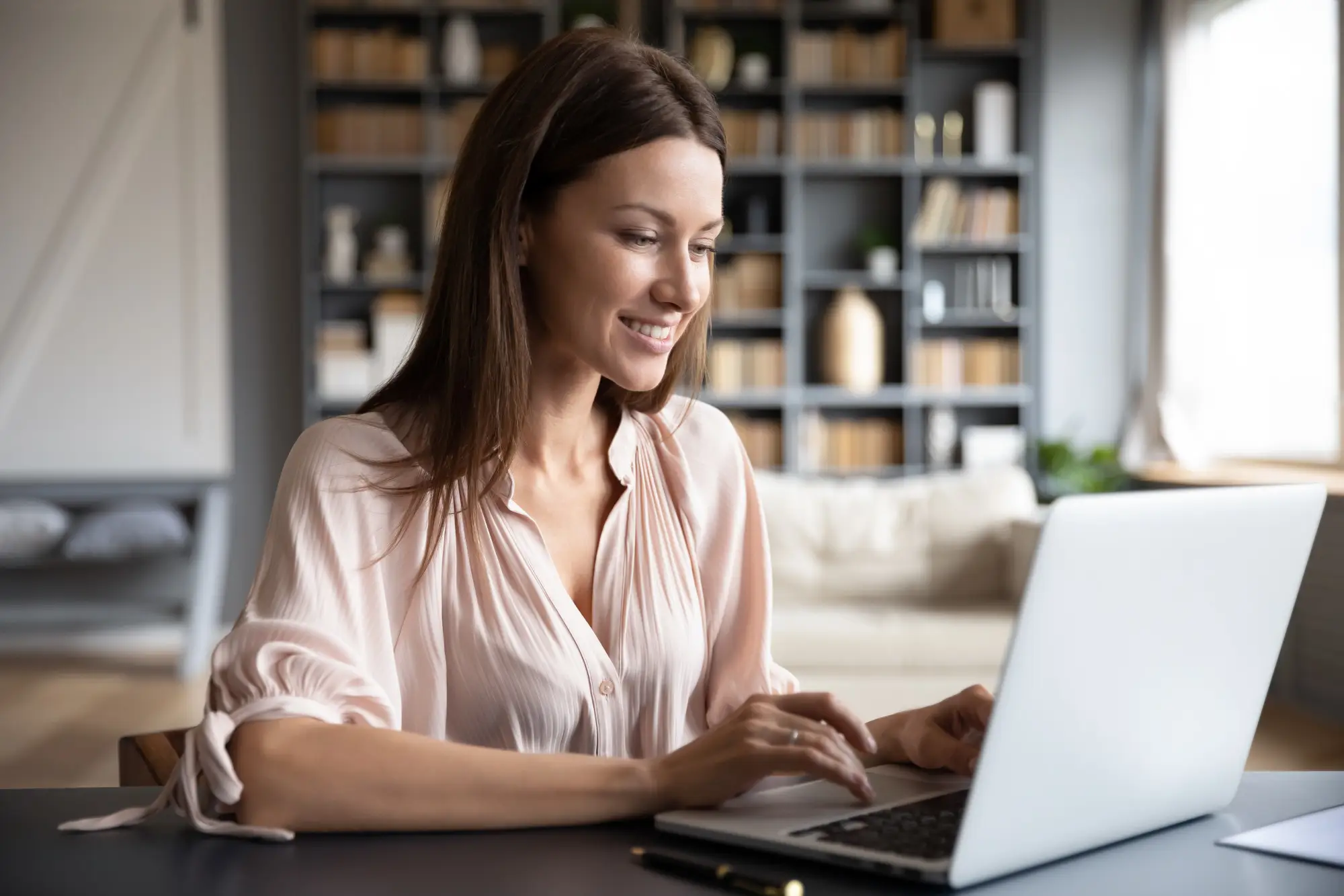 Woman sitting in front of a laptop