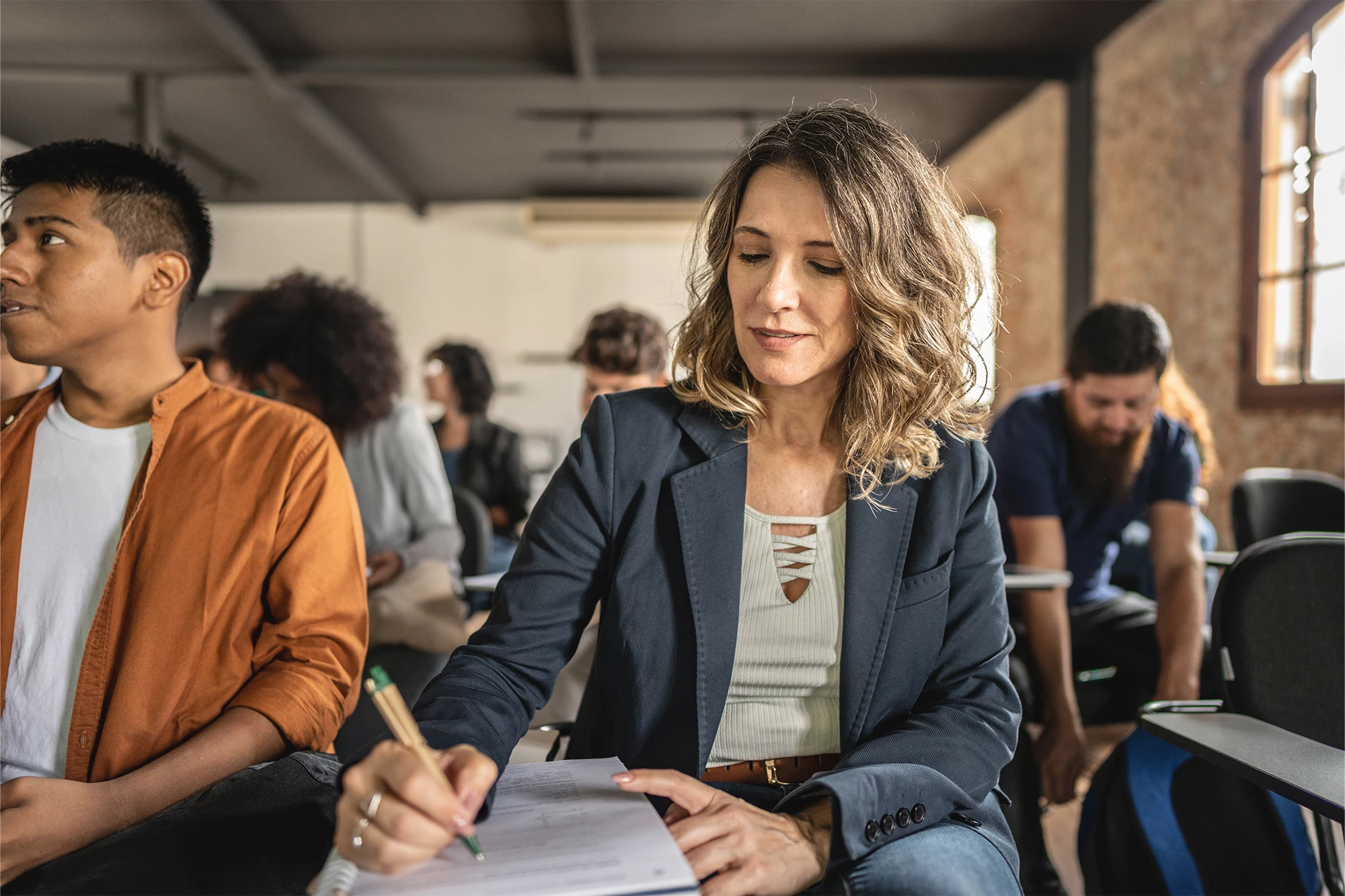 dearborn - man and woman in classroom taking notes