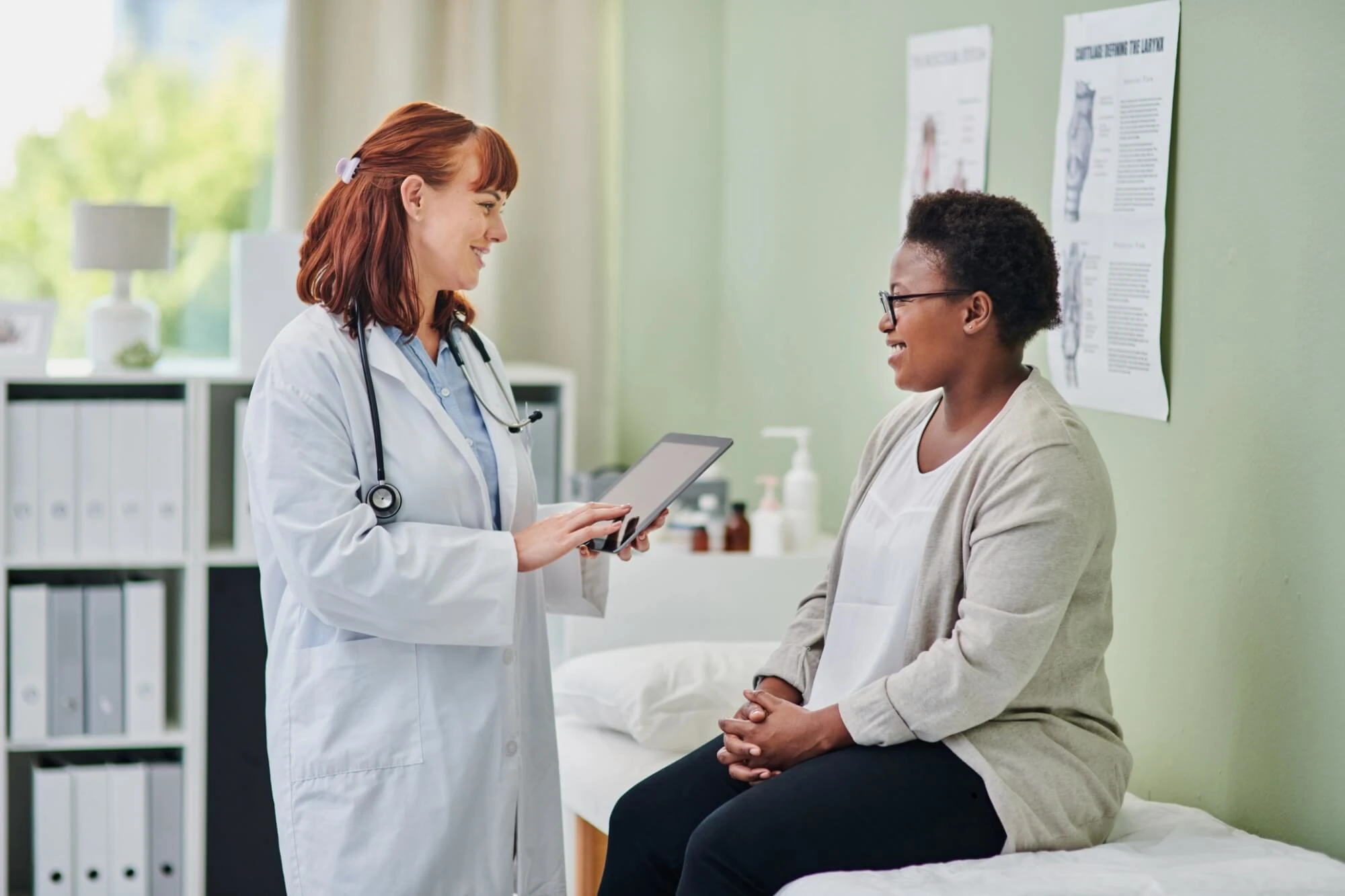 woman doctor speaking to a woman patient
