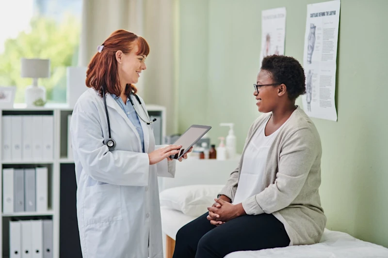woman doctor speaking to a woman patient