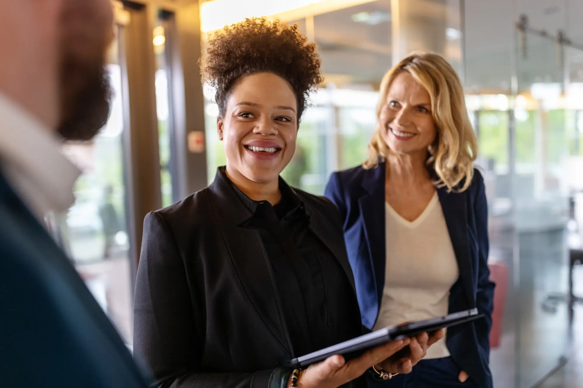 group of smiling people in a office setting