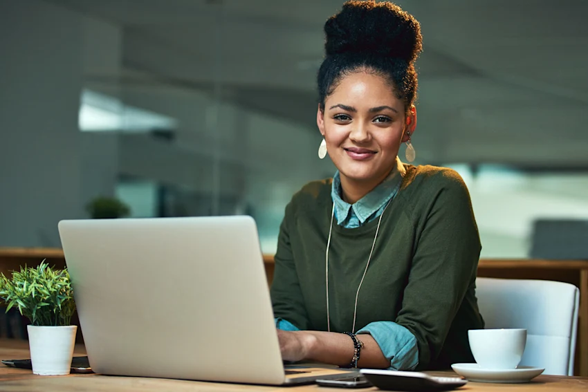 Female student sitting at a laptop