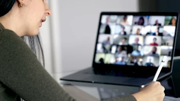 Female student in a online class at a computer